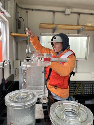 Natalia Llopis Monferrer removing a phaeodarian colony from a D sampler onboard the ship.